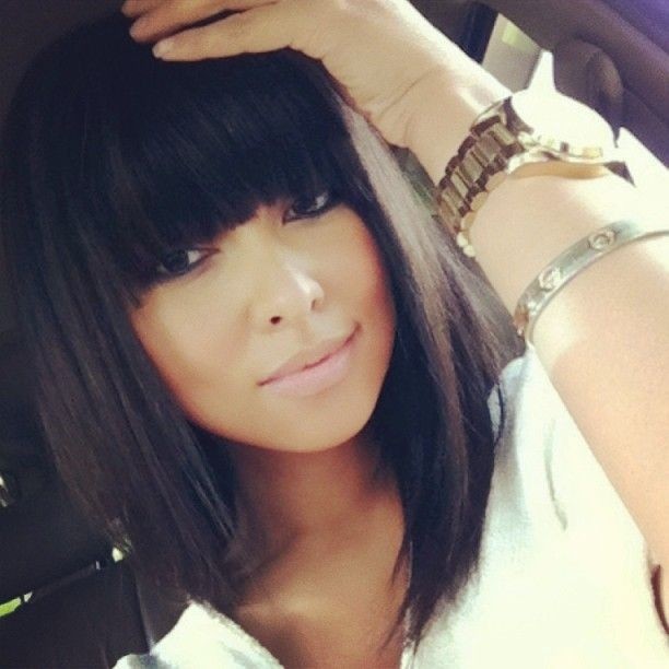 Long bob hair cut straight with sharp bangs