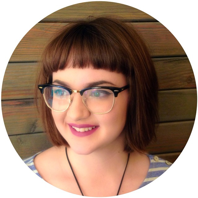 A nice brunette Bob, with sharp bangs with glasses