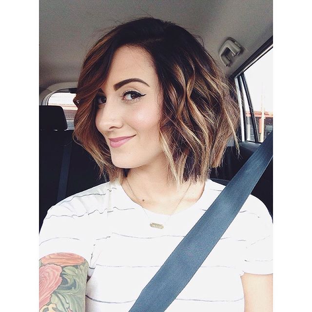 A short, messy bop hairstyle with bangs