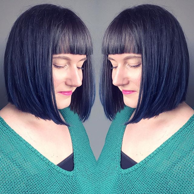 Darkly dark hairstyle with sharp bangs for women more than 40
