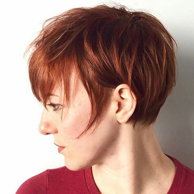 A side view of a short pixy hair cutting