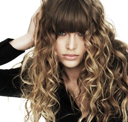 Toller curly hairstyle with sharp bangs