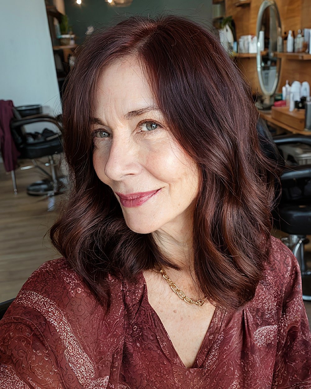 Mid-length chocolate brown hair with soft mahogany tones for older women