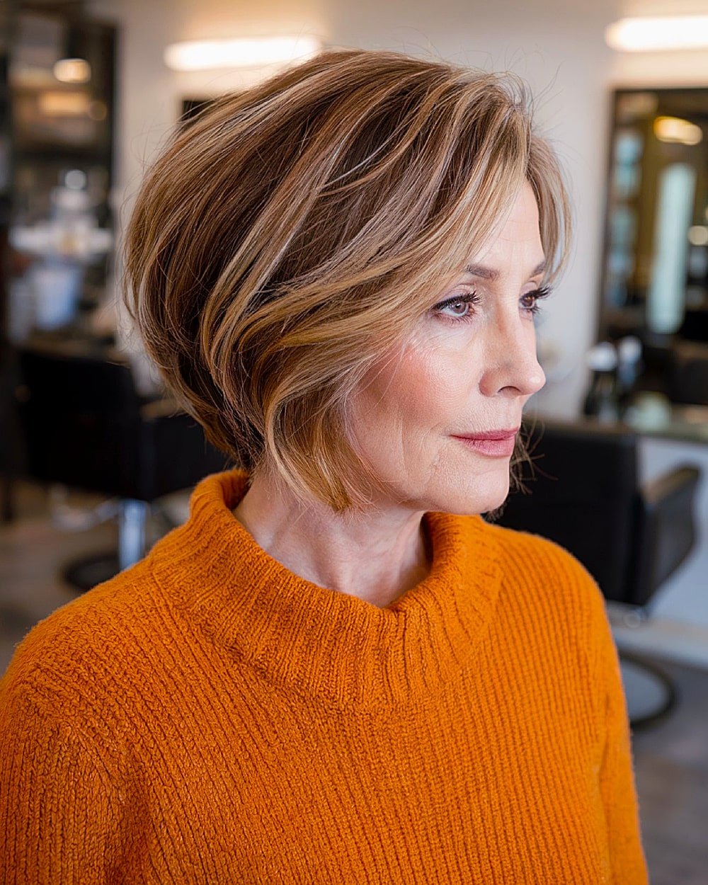 Stacked inverted bob with balayage highlights for women over 60 with brunette hair