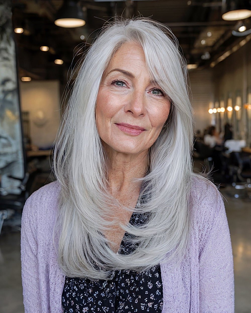     Long, layered silver hair over 60 with feathers framing the face