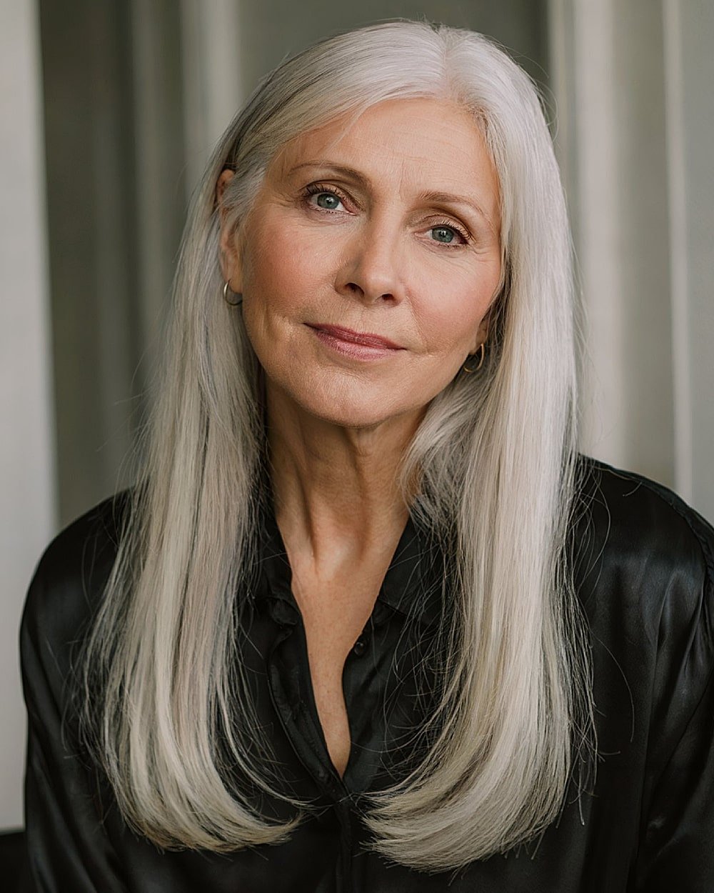 Long straight silver hair over 60 with blunt ends and a middle part