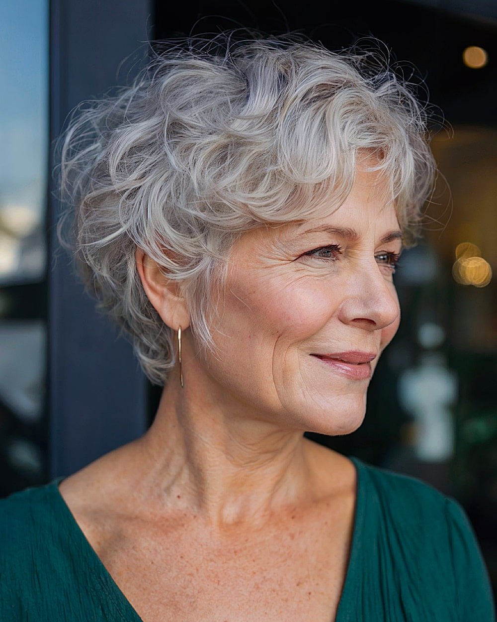 Short wavy cut for thin gray hair over 60, soft volume and side texture