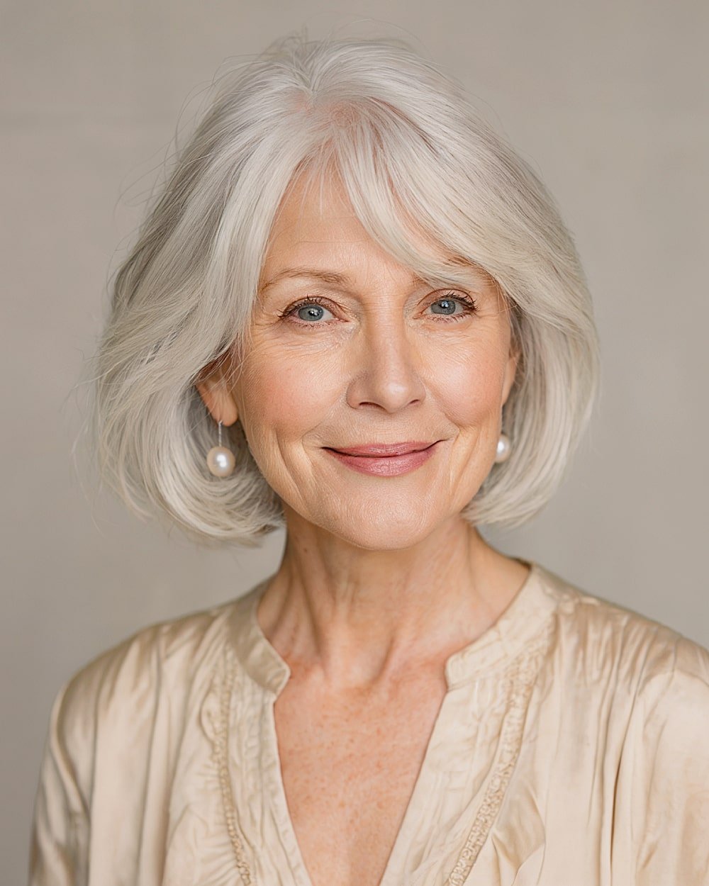 Luminelle is a classic chin length haircut with soft layers and side bangs for mature women