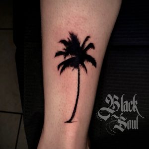Palm Tree Tattoos: Symbols of Freedom, Relaxation, and Resilience
