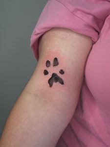 Paw Print Tattoos: A Tribute to Loyalty, Love, and Companionship