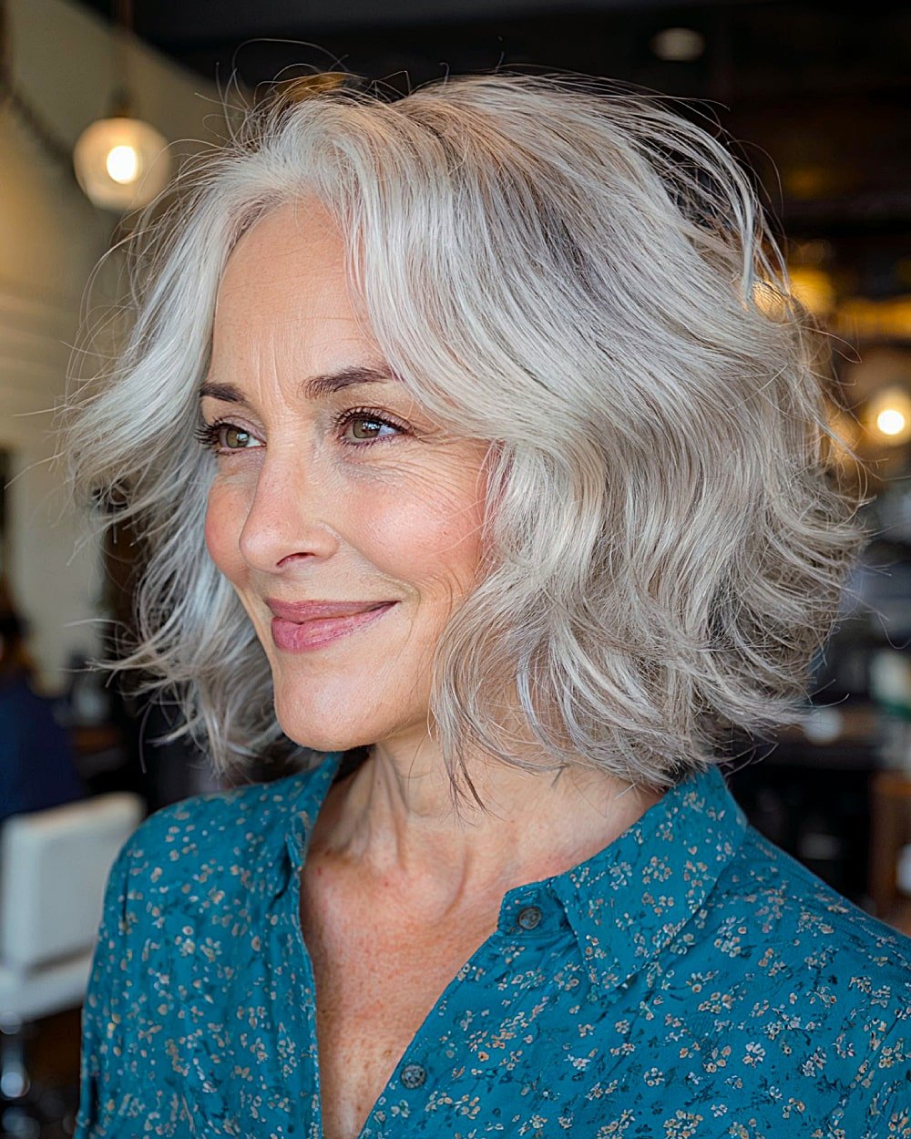 Short wavy cut with gray layers for women over 60, soft style defines the face with natural volume