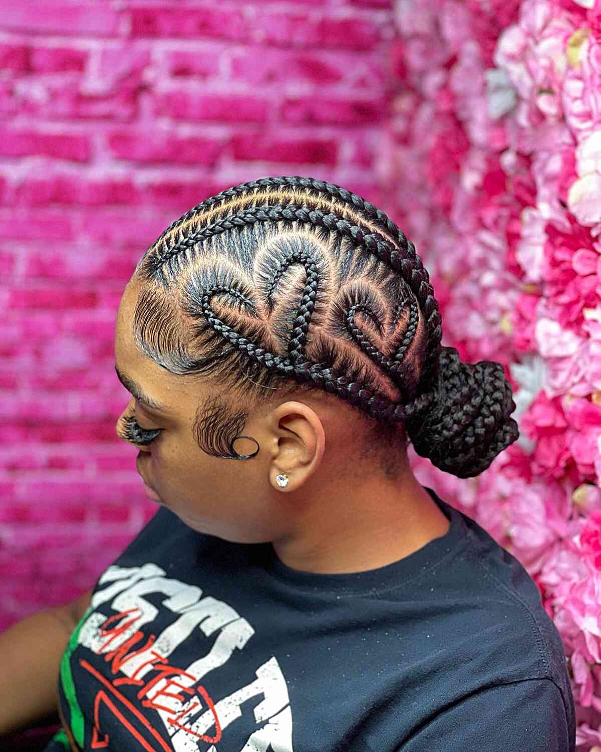 Heart shaped side braids and low bun for black women