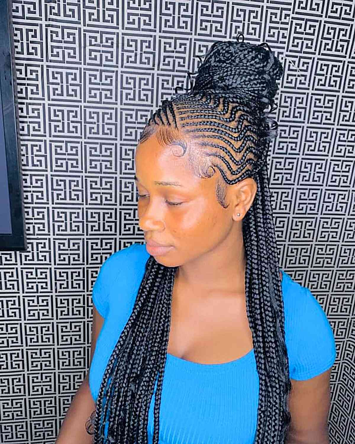 Half cornrow braids with bun for long black hair