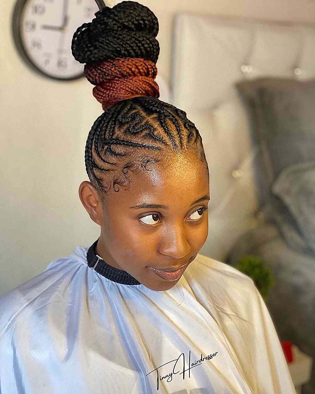 A 4-layer topknot bun with small braids