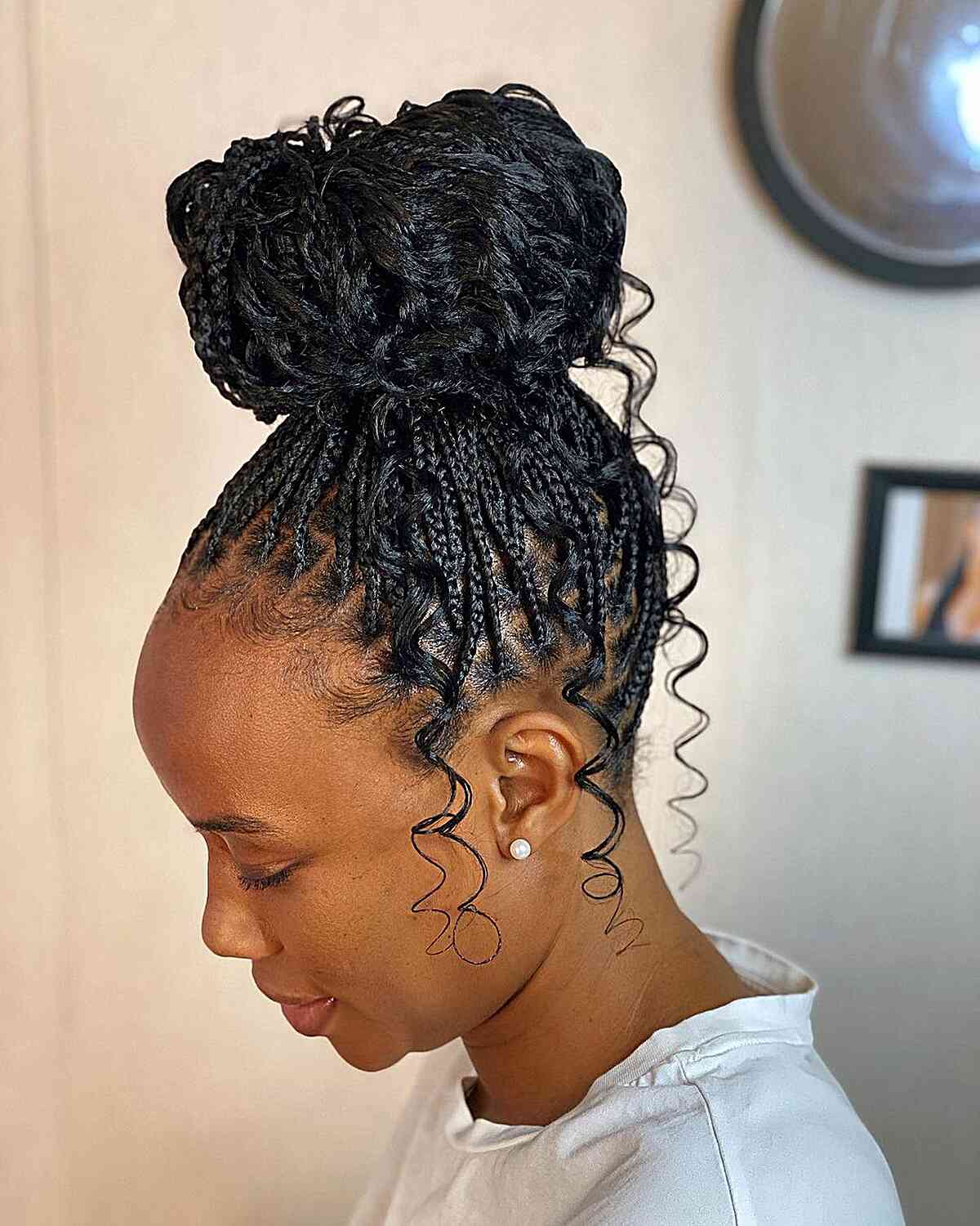 Updo bun box braids with wavy pieces