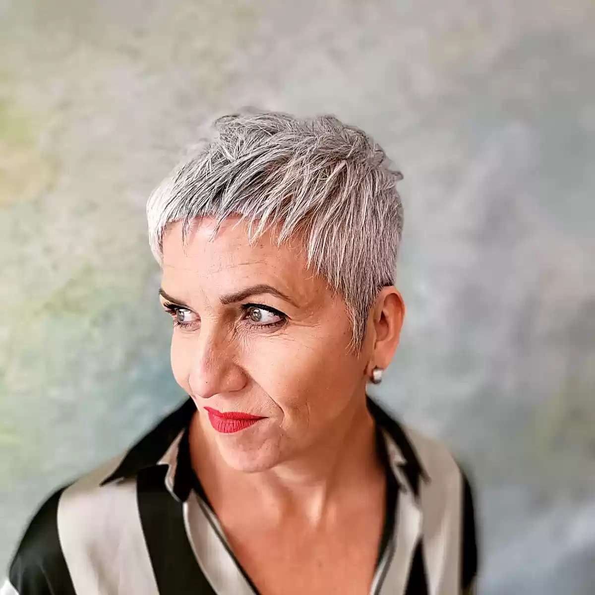 The choppy layered silver pixie is for seniors over 60 and those with thin hair