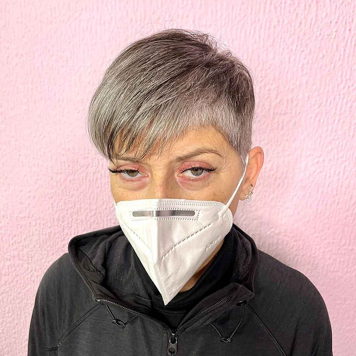 A short pixie with a short side of soft silver hair