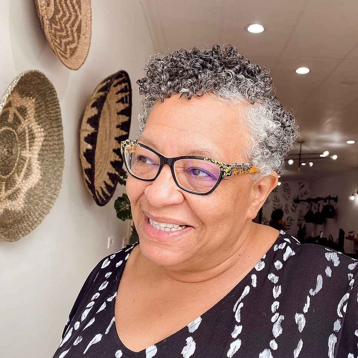 Side-parted pixie for older women with natural curls