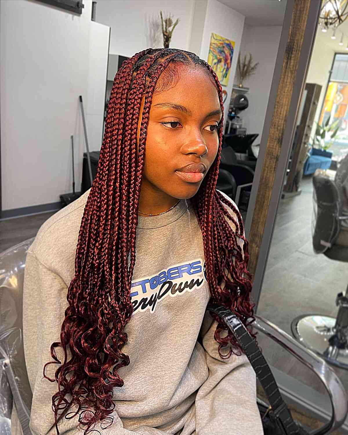 Long, medium-sized braids without knots in cherry red with a middle part