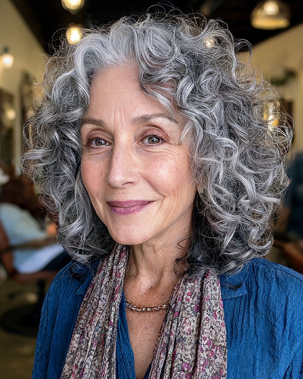 Shoulder length layered curls for women over 60 with gray hair