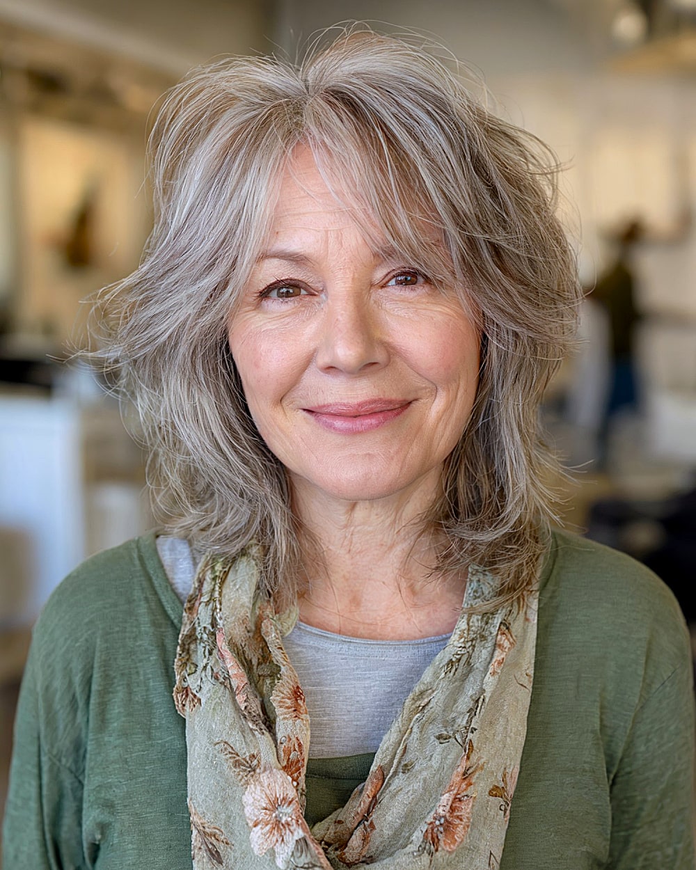 Shaggy bob with soft layers and curtain bangs for women over 60 with gray hair