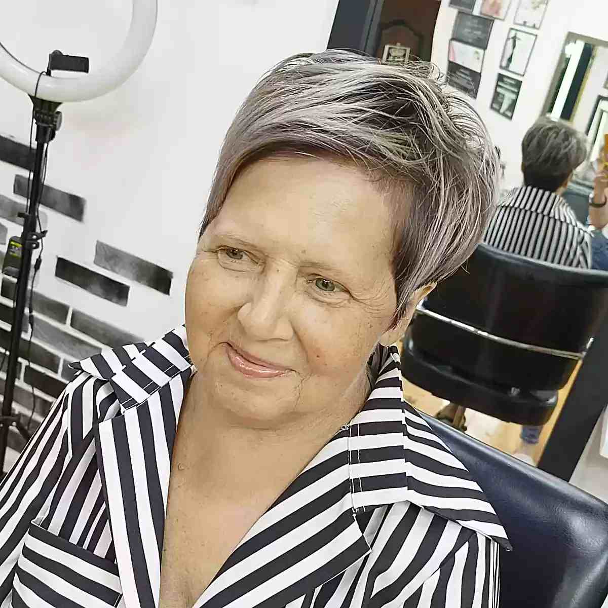 Long side-swept silver pixie cut on 60+ ladies with round faces