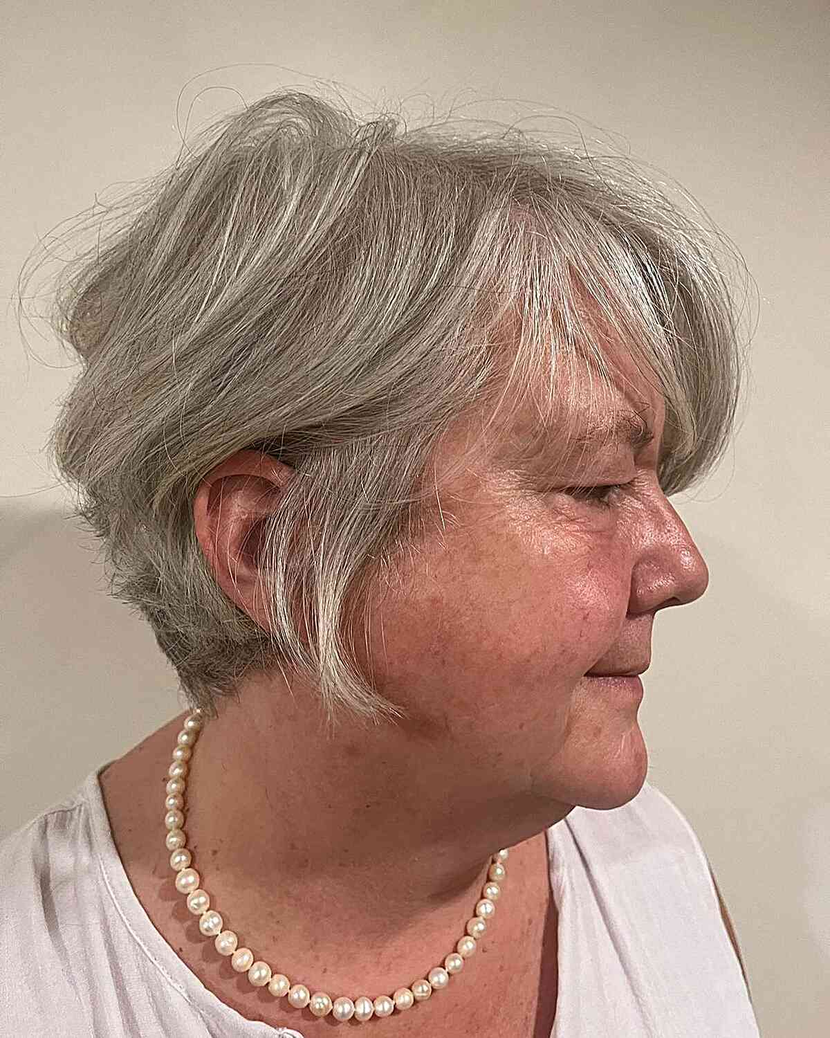 Soft short pixie with fringe for 60+ year olds with round faces