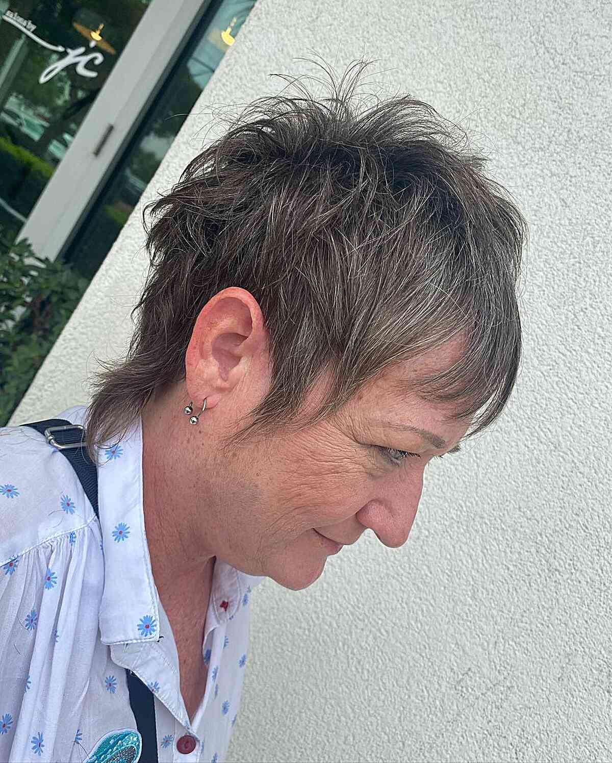 Choppy Pixie Shag Crop with Light Bangs on Gray-Haired Women Over 60