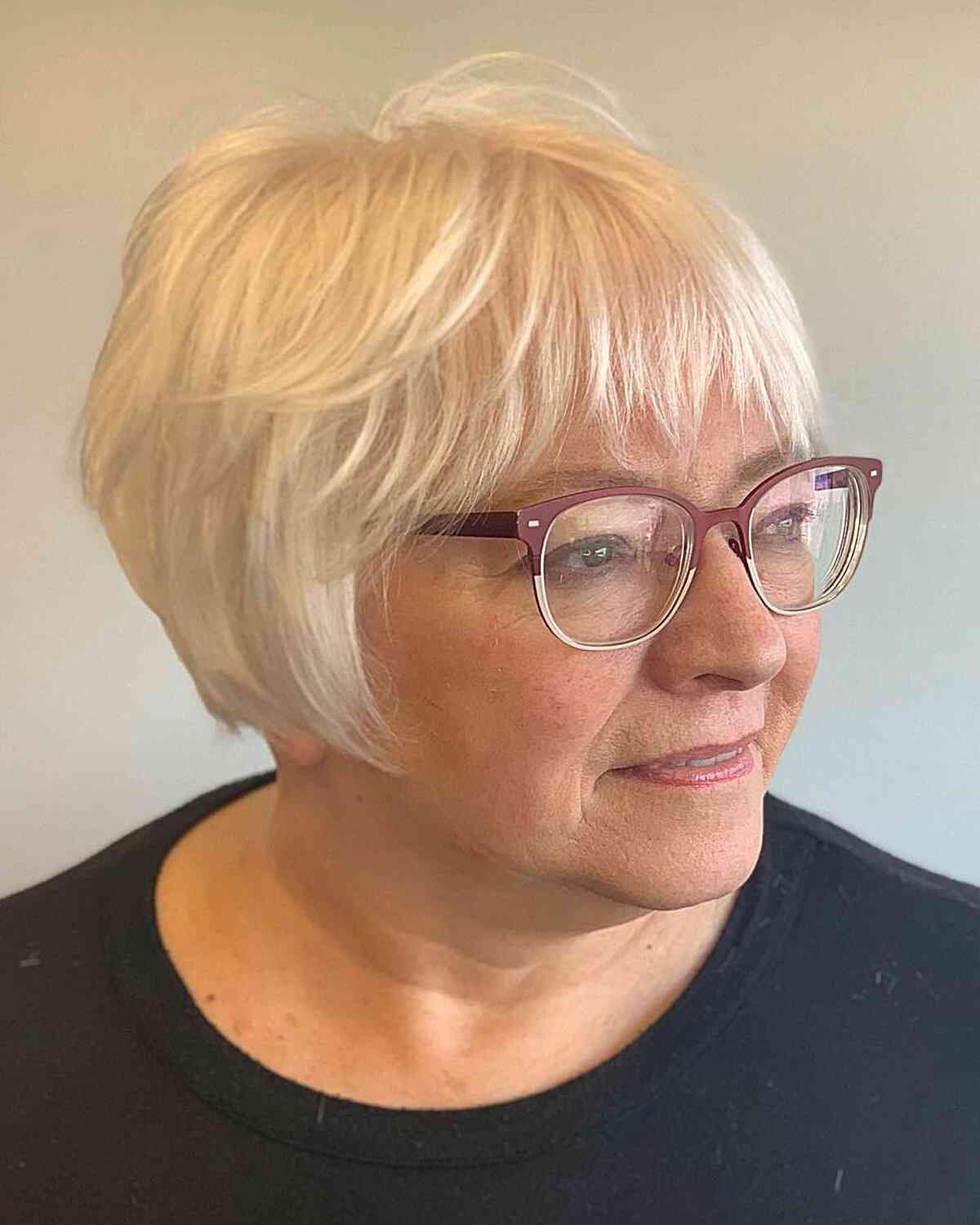 White french bob with choppy bangs for 60 year old women with straight hair and glasses