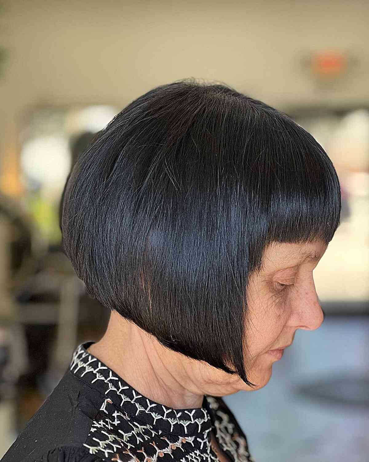 Jaw length bob with short bangs for older women over 60 with black hair