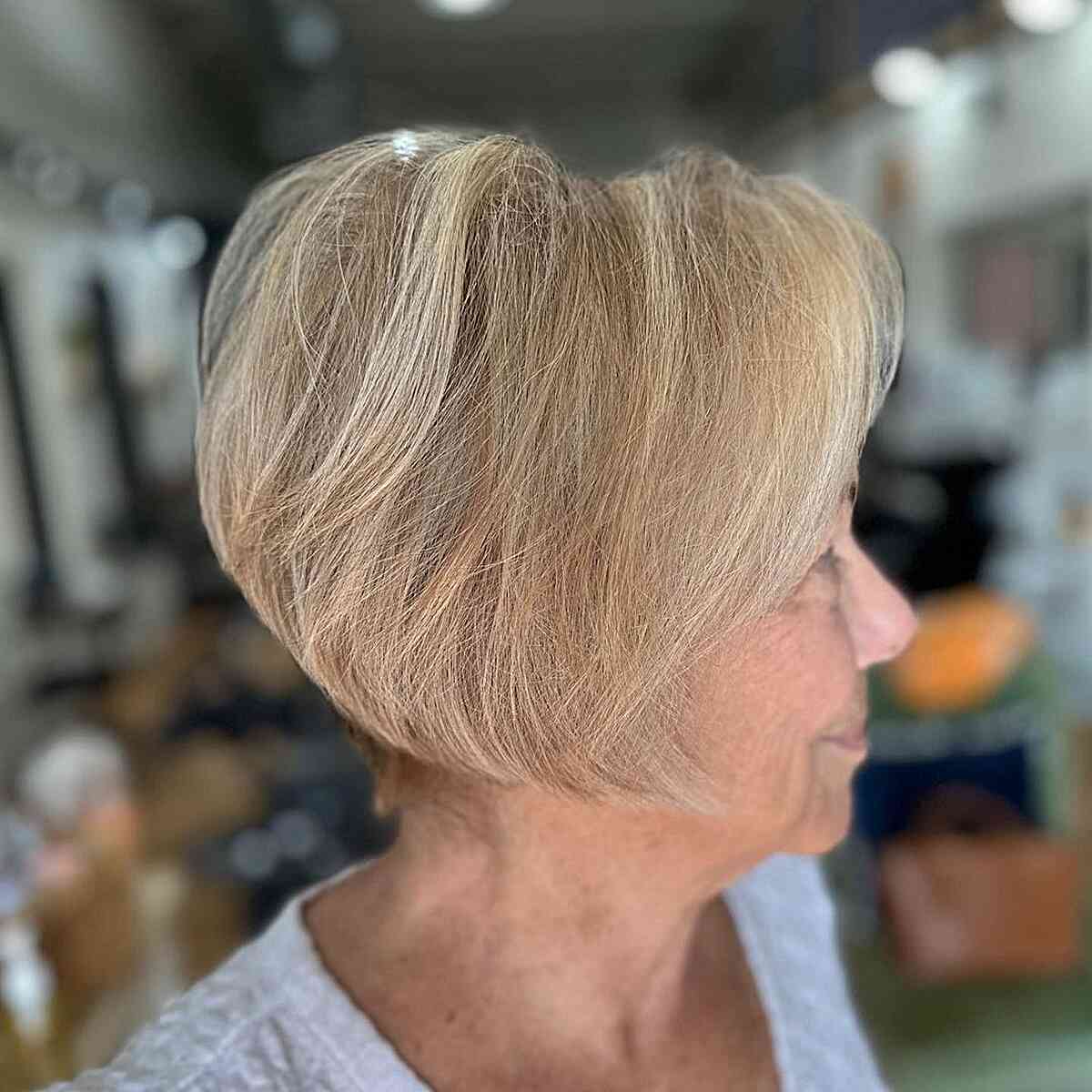 Dimensional stacked, jaw-length bob with a tapered butt for older women 60 and up