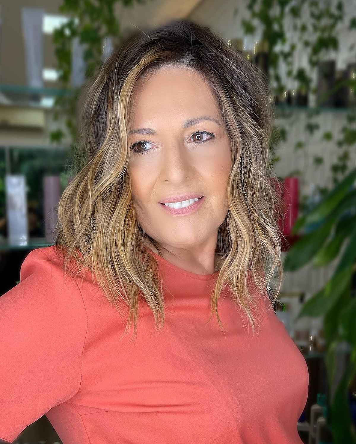 Medium length layered cut with beach waves