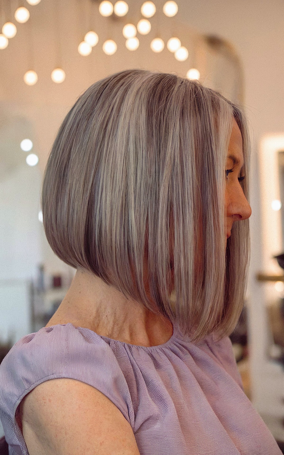 Long angled hairstyle for a woman in her 60s