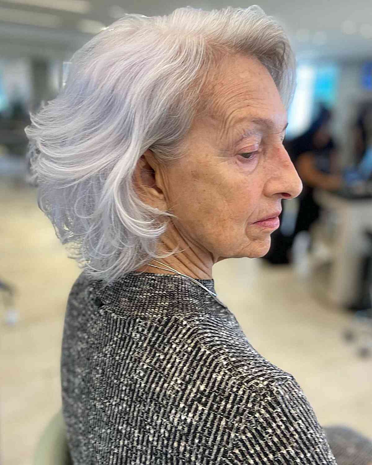 Messy, wavy bob with feathered layers for seniors over 60 with thick hair