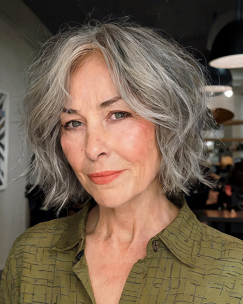Chin-length wavy bob with ash-gray balayage for women over 60
