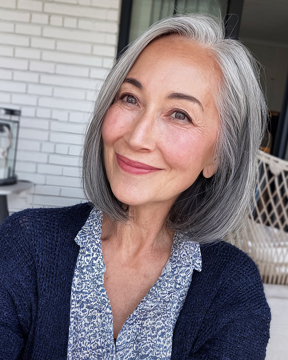 Shoulder-grazing bob with gray ombre on straight hair for women over 60 years old
