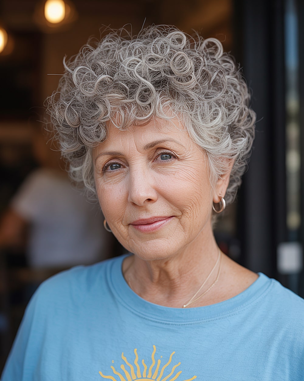 Short curly crop for gray hair over 60 with soft ringlets and full volume