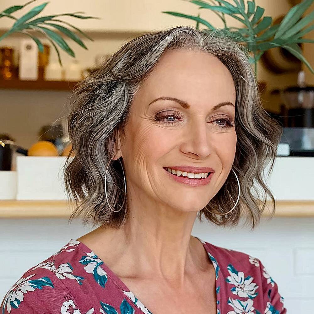 Layered with salt and pepper for dimension and movement, this haircut is a stylish option for women over 60