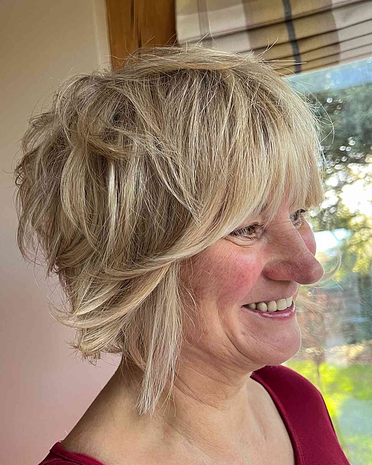 Shaggy pixie bob with messy layers and fringes on 60+ older ladies