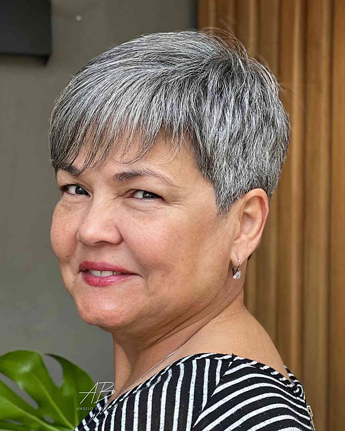Tapered pixie cut with soft bangs for 60 year old women with round faces