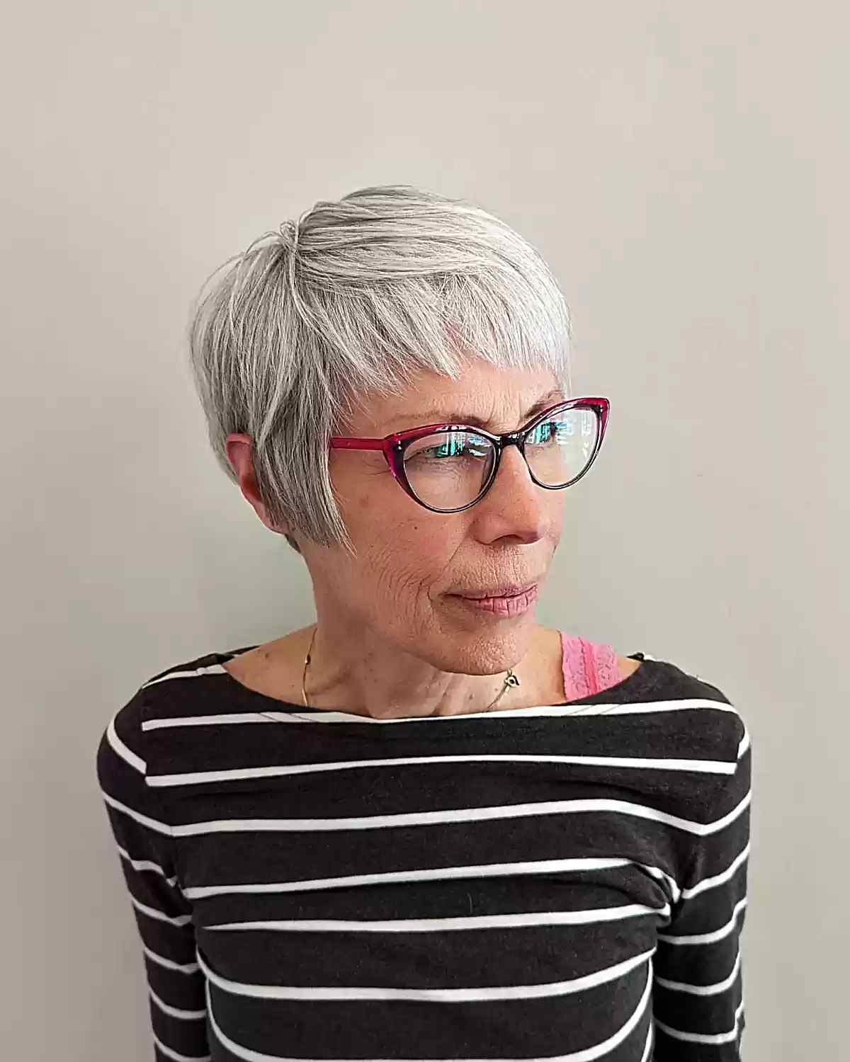 Layered pixie hair with short bangs for women over 60