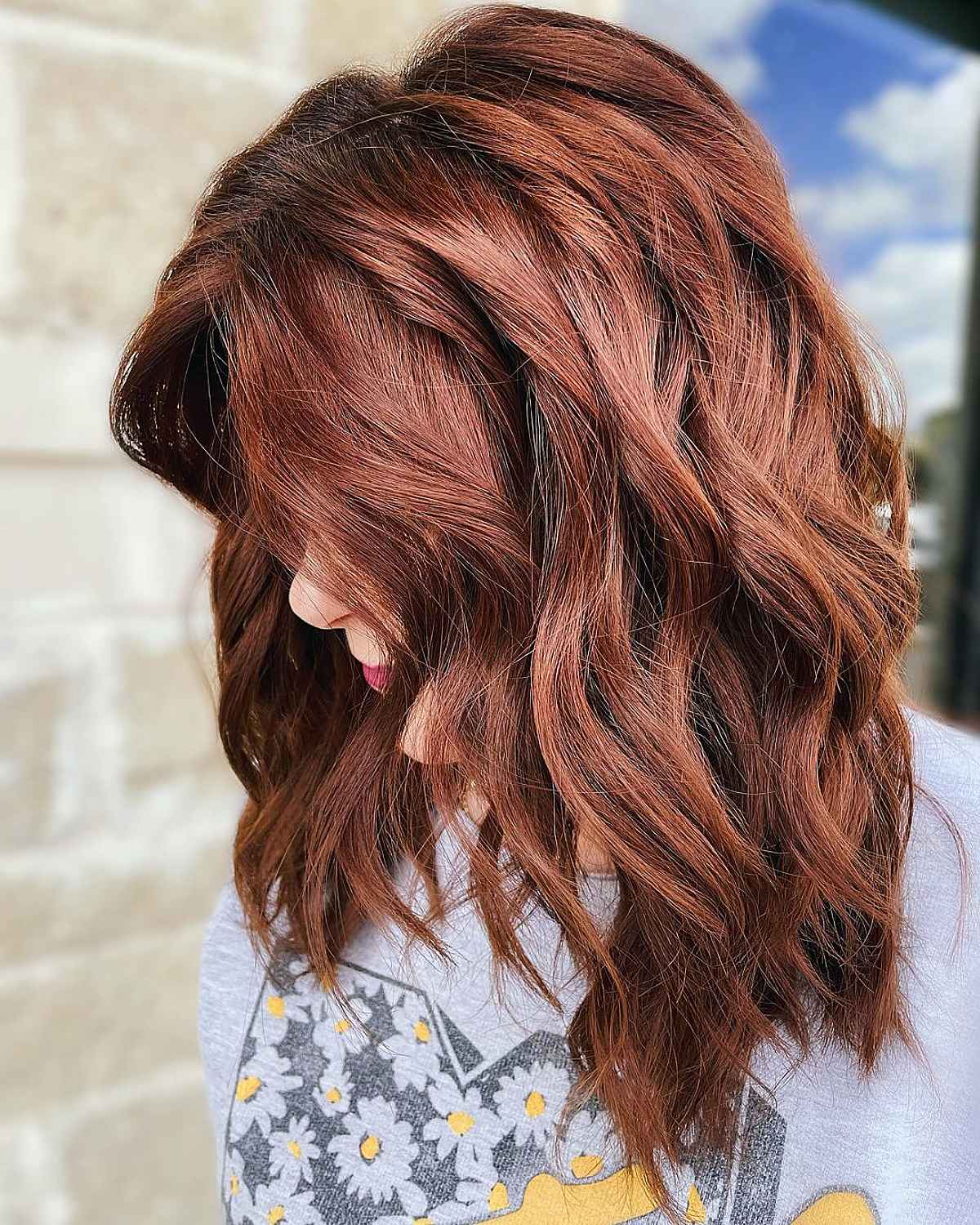 Medium length cut with dark auburn balayage