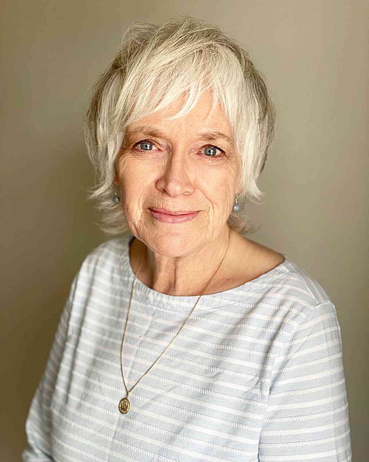 Nape-Length Razored Pixie Shag with Side Bangs for Seniors Aged 60