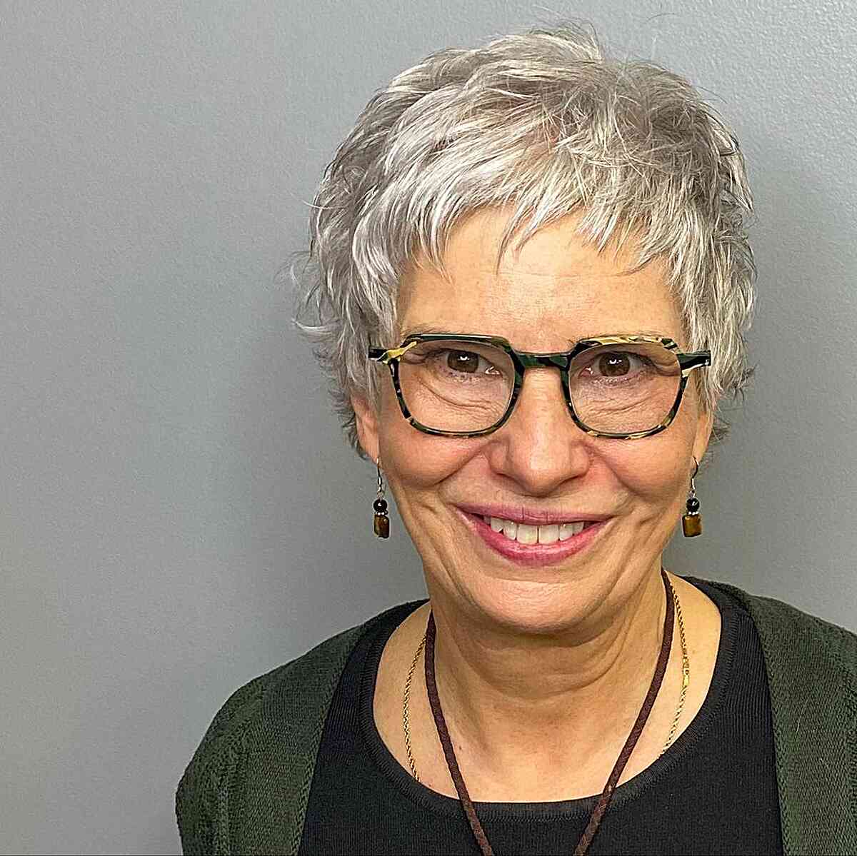Wavy silver pixie cut with fringe for women over 60 with glasses